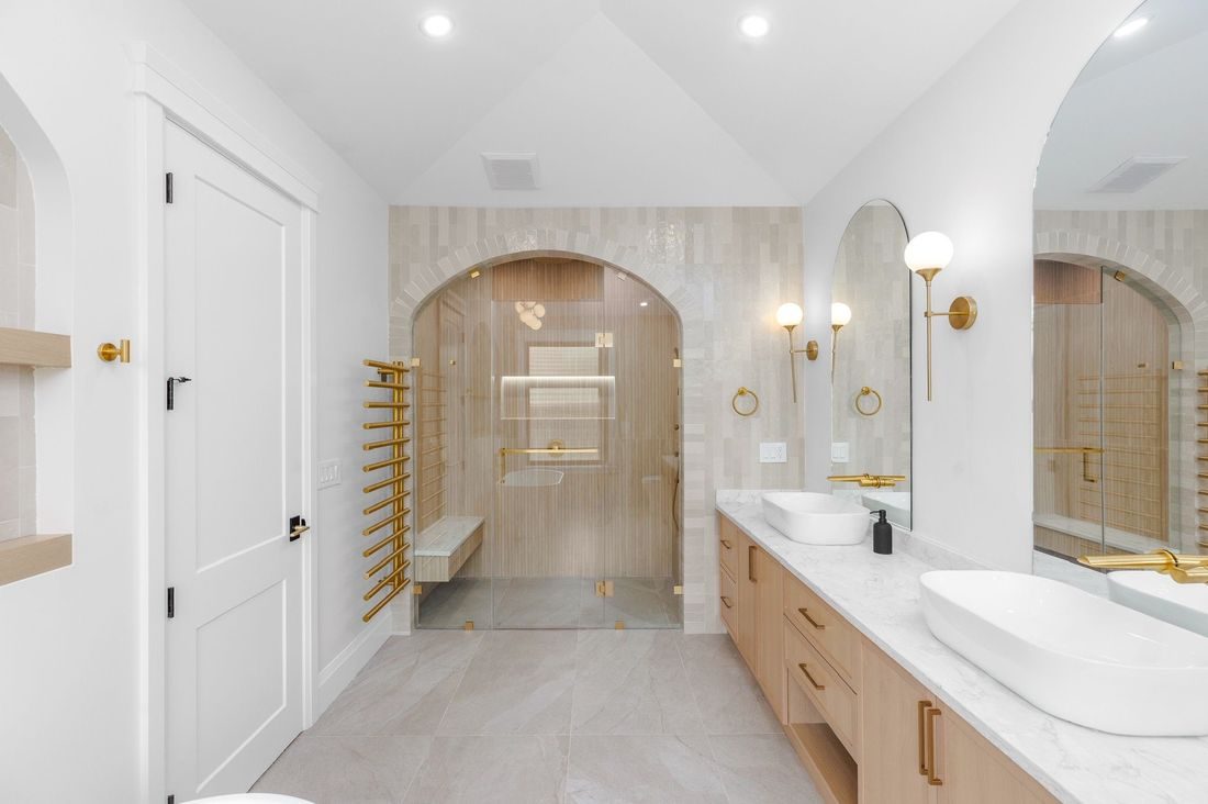 Design concept render: arched steam shower with frameless glass and brass hardware