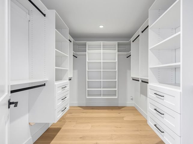 Design concept render: white walk-in closet with built-in shelving and drawers