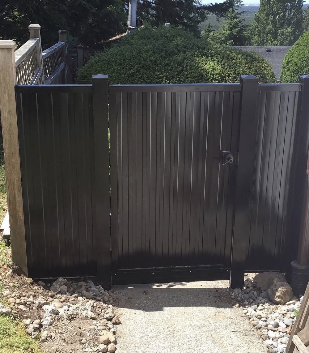 Black aluminum privacy fence and gate installation