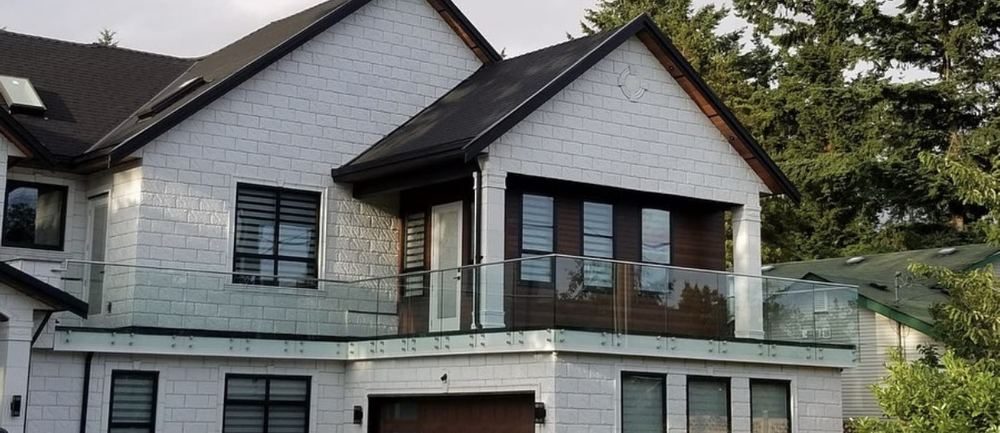 Exterior frameless glass balcony railing on a Metro Vancouver home