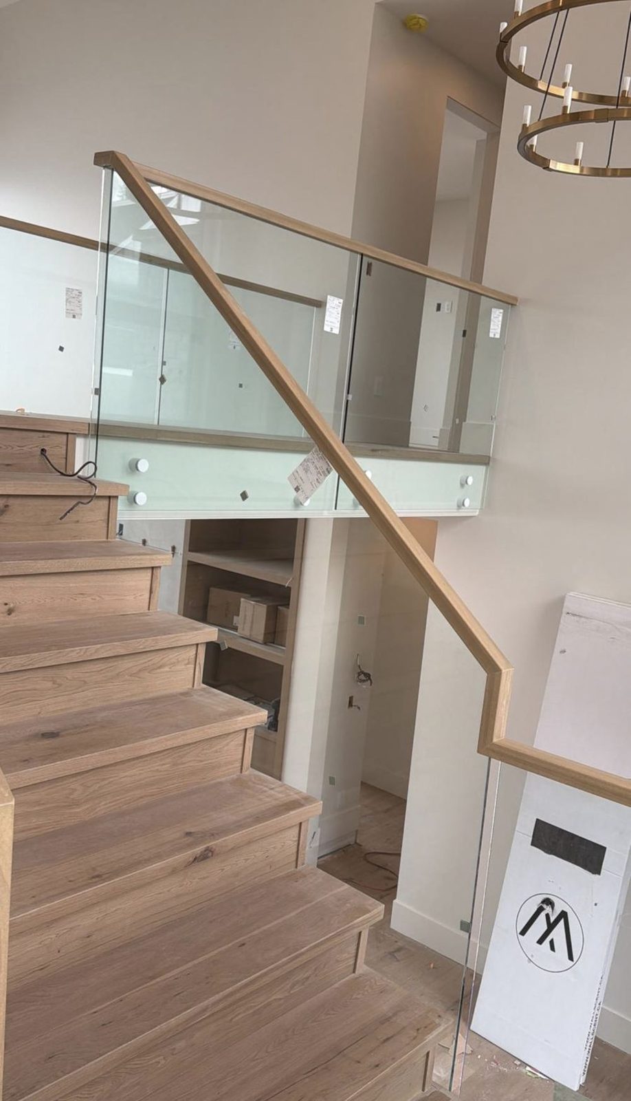 White oak staircase with glass railing and a white oak handrail