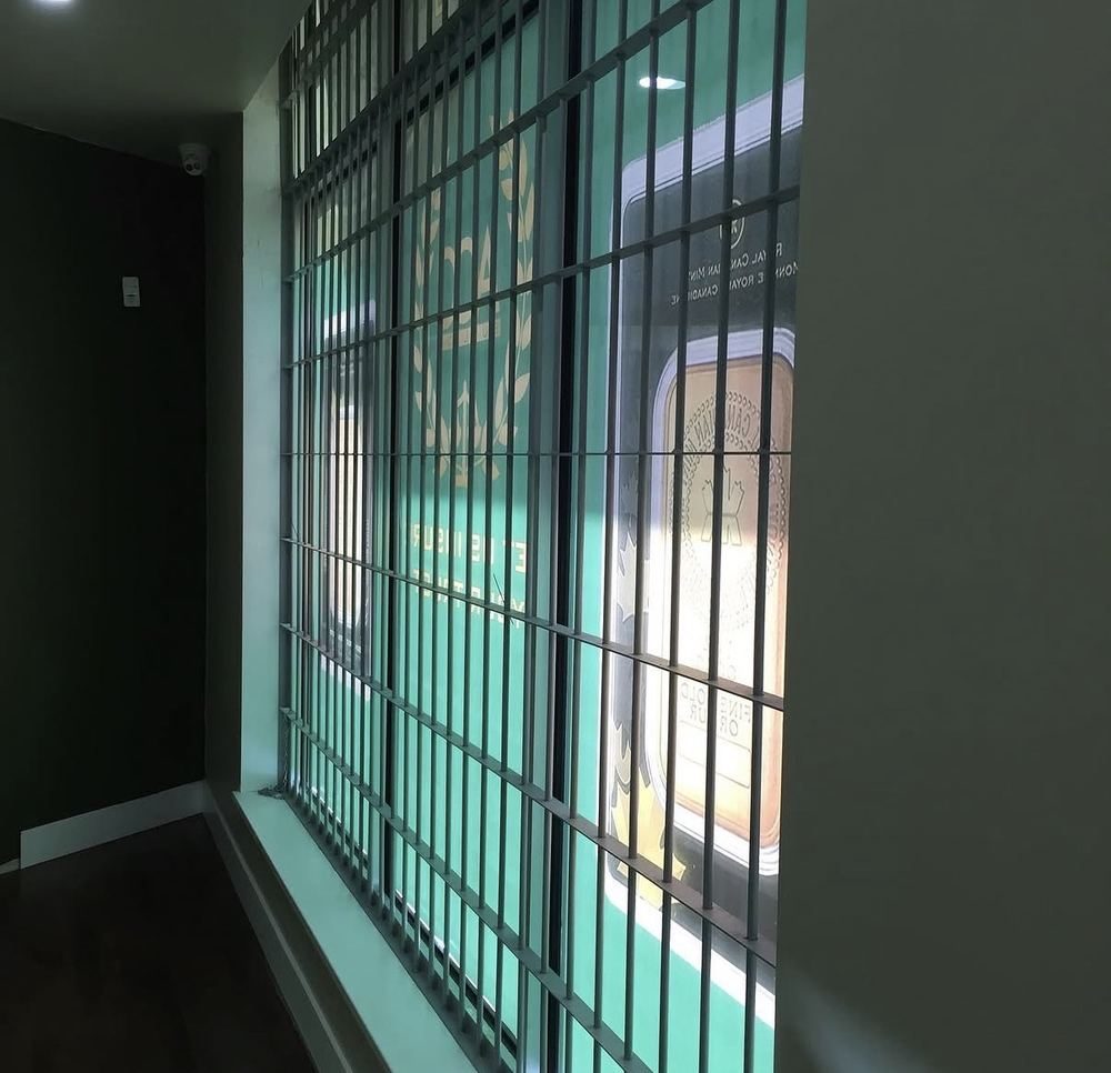 Fabricated steel security bars on a commercial storefront window